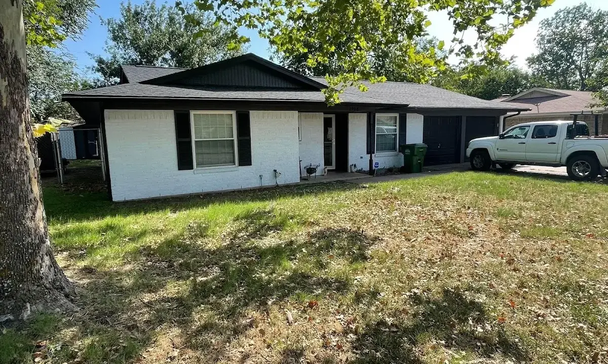 Professional roofing crew working on a residential roof in Eidson Road